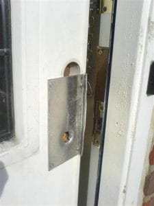 Aluminium door plated fitted on front door