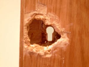 Hole in Wooden Door