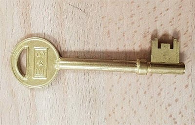 a large gold mortice key