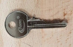 a small silver Yale type key