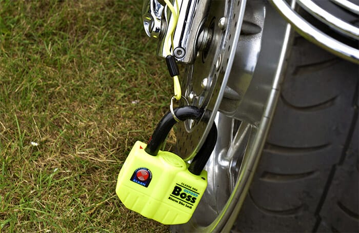 A motorcycle disc lock alarm fitted to motorcycle wheel