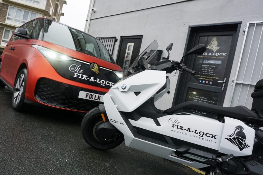 Locksmith Van and Eco friendly scooter outside locksmith shop