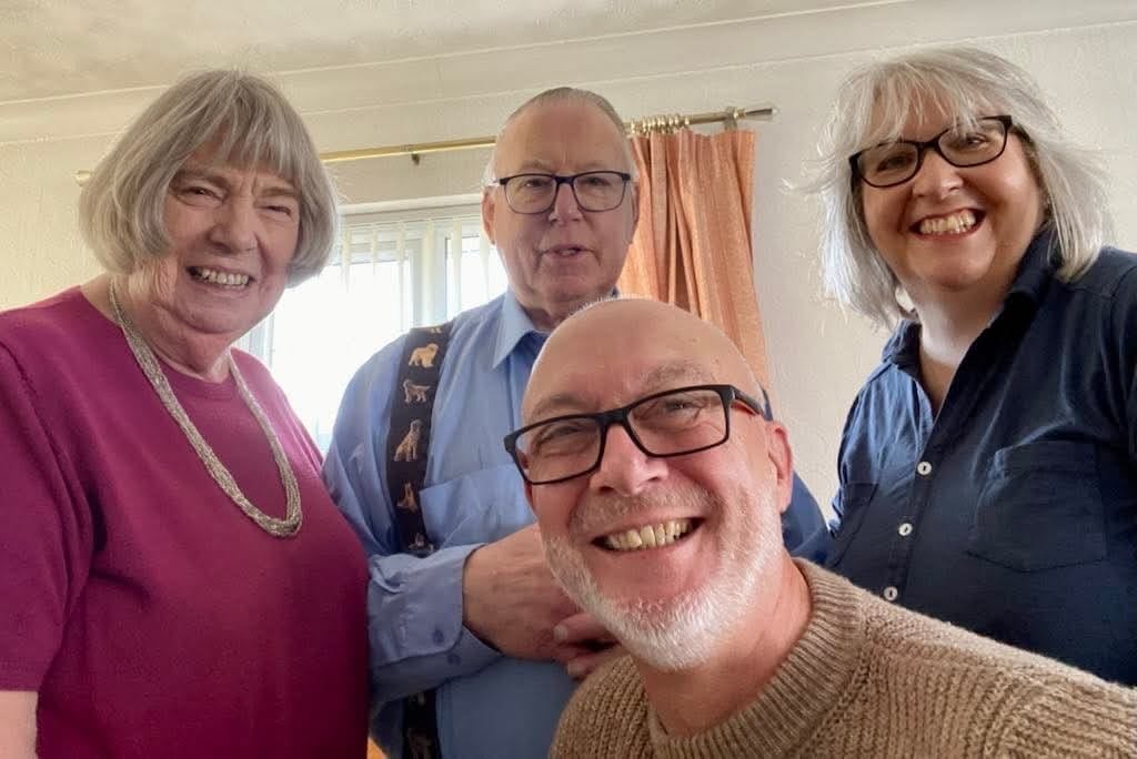Paul and Colin Harper‑Smith pictured together at home with their family. 