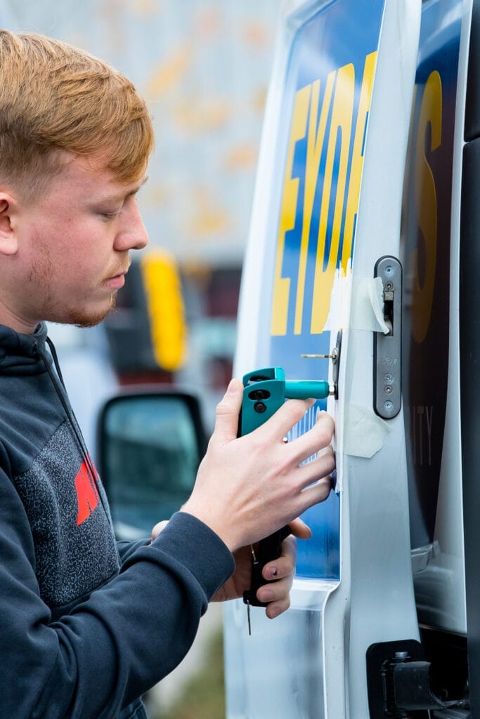 Locksmith installing a van lock to a van 